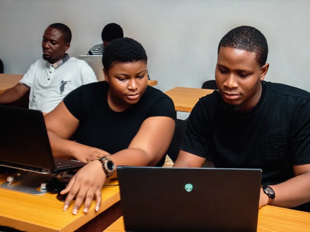 Two learners working through an exercise together in Port Harcourt